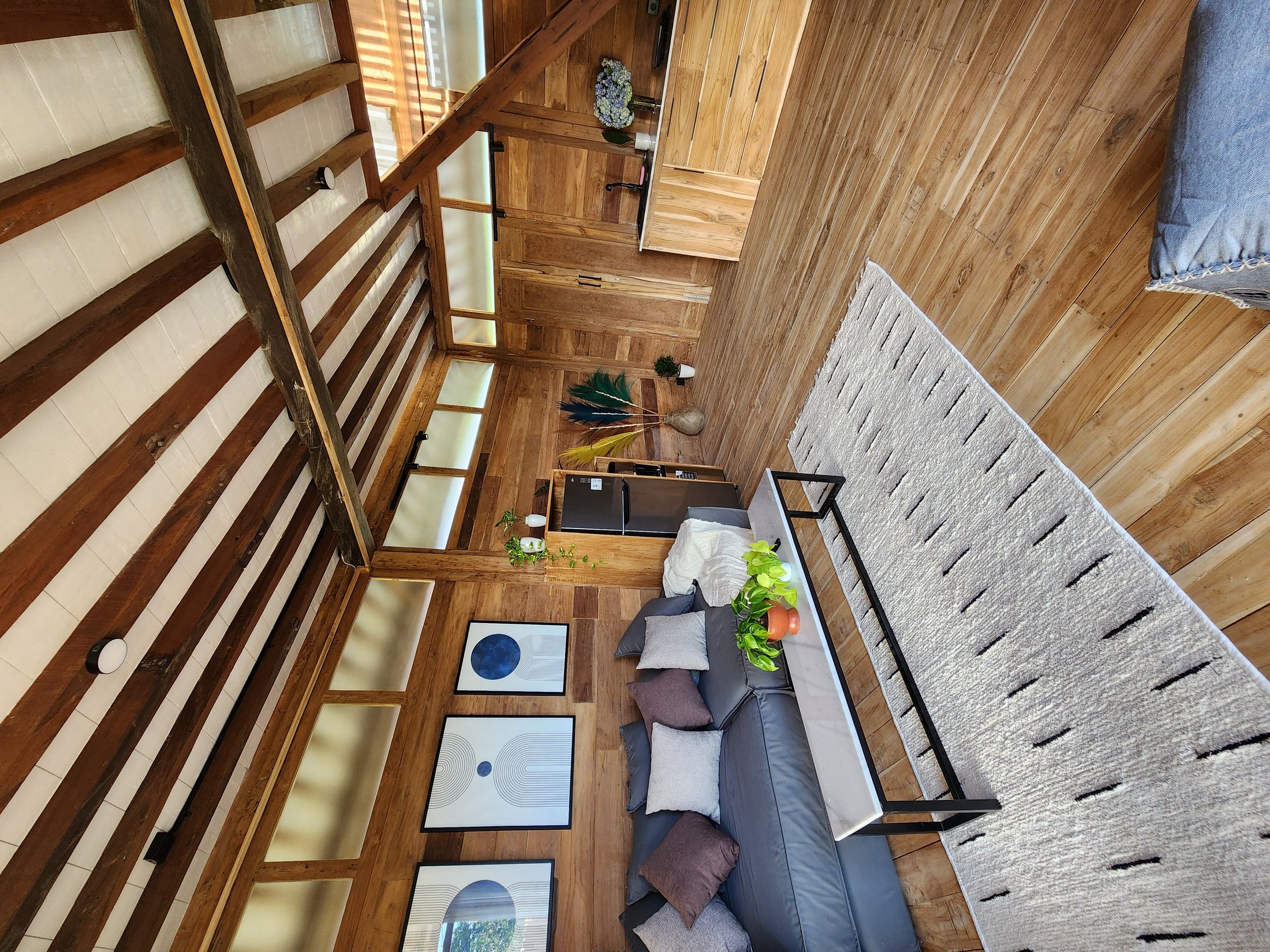 Rumah Jati living room opening to the rice fields